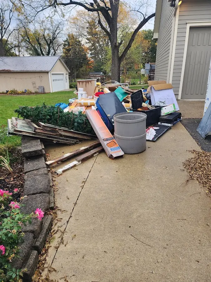 Dumpster being loaded with debris for Demolition Dumpster Rental in Fox Lake